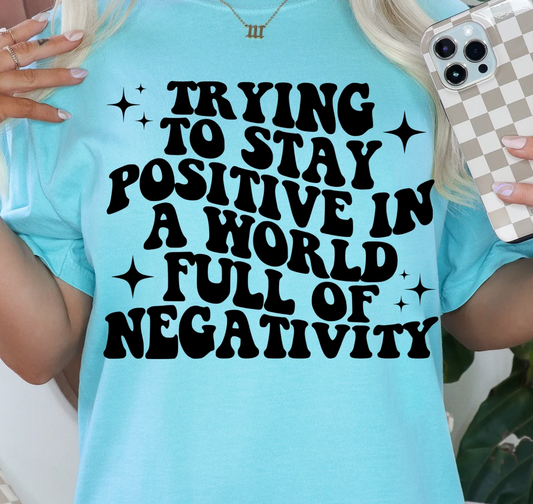 TRYING TO STAY POSITIVE IN A WORLD TEE